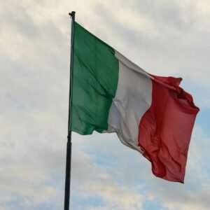 a couple of flags on a flagpole